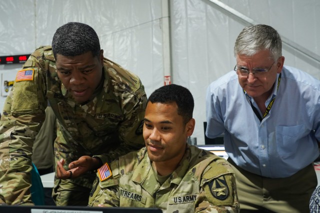 Army analysts discuss Project Convergence 22 data analysis at the Table of Knowledge.