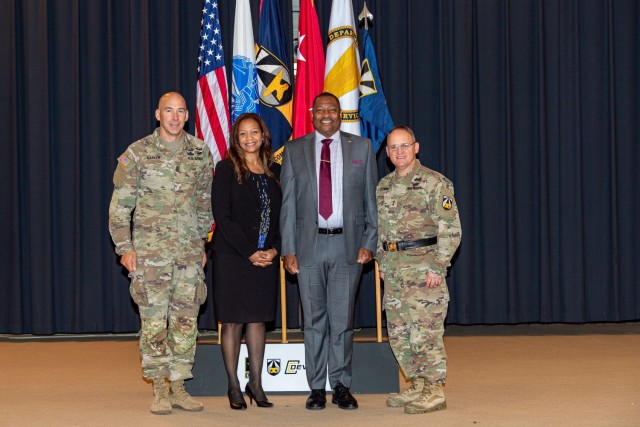 (Left to right) Command Sgt. Maj. Bryan D. Barker, April Moore, Eric Moore, Ph.D., and Maj. Gen. Edmond ‘Miles’ Brown at a ceremony at Aberdeen Proving Ground, Maryland, October 14, 2022. Moore, who was the director of DEVCOM Chemical...