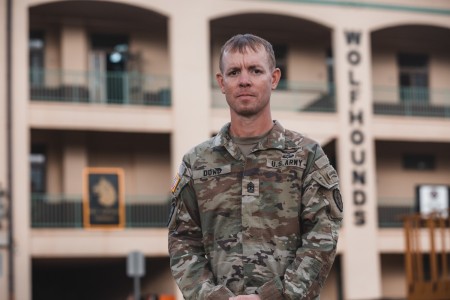 1st Sgt. William P. Dowd, Charlie Company, 2nd Battalion, 27th Infantry Regiment, 3rd Infantry Brigade Combat Team, 25th Infantry Division, stands in front of his battalion headquarters on Schofield Barracks, Hawaii, Oct. 17, 2022. Weeks earlier, on Oct. 6, 2022, Dowd was at his son&#39;s football practice at Kapolei Community Park when he responded to a nearby car crash and applied makeshift tourniquet to one of the victims.