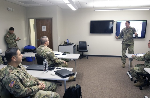 The finer points of an After Action Review are discussed by a classroom of First Army battalion and brigade command team members at the First Army OC/T Academy on Rock Island Arsenal, Ill.  