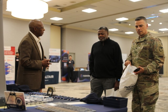 Col. Manny Ramirez, Fort Stewart-Hunter Army Airfield garrison commander, receives information from a vendor during a technology expo, Oct. 20 at Club Stewart on Fort Stewart. Senior leaders from 3rd Infantry Division and Fort Stewart had the opportunity to see and touch cutting-edge technology present at the expo and received product information from vendors there. (U.S. Army photo by Pfc. Dustin Stark, 50th Public Affairs Detachment)