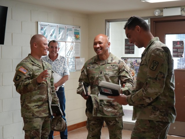 U.S. Army Garrison Daegu Senior Enlisted Leader Command Sgt. Maj. Jonathon J. Blue (left) and U.S. Army Installation Management Command-Pacific Senior Enlisted Advisor Command Sgt. Maj. Jon Y. Williams (center) share a laugh during a tour of barracks facilities at Camp Carroll, Republic of Korea, October 20, 2022. Williams and other senior leaders from IMCOM-Pacific visited South Korea to &#34;collaborate with every garrison command team on the peninsula and to focus on our organization’s priorities of taking care of Soldiers, families and veterans.&#34;