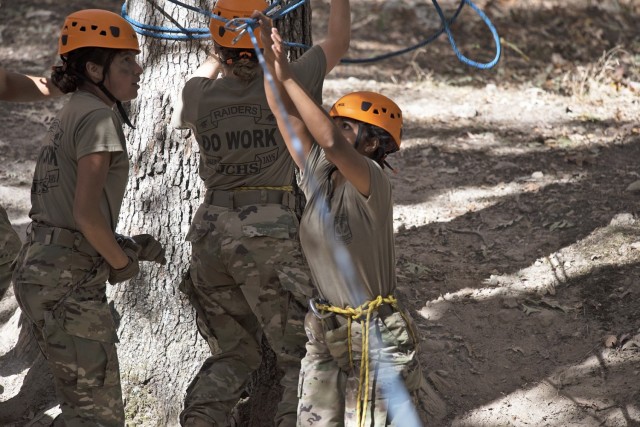 Junior ROTC cadets from Junction City High School, in Junction City, Kansas, set up a one-rope bridge Saturday at Training Area 98 during the 2022 Raider Challenge competition. The team placed first in that event, with a time of 1 minute, 40 seconds, and fourth overall.
