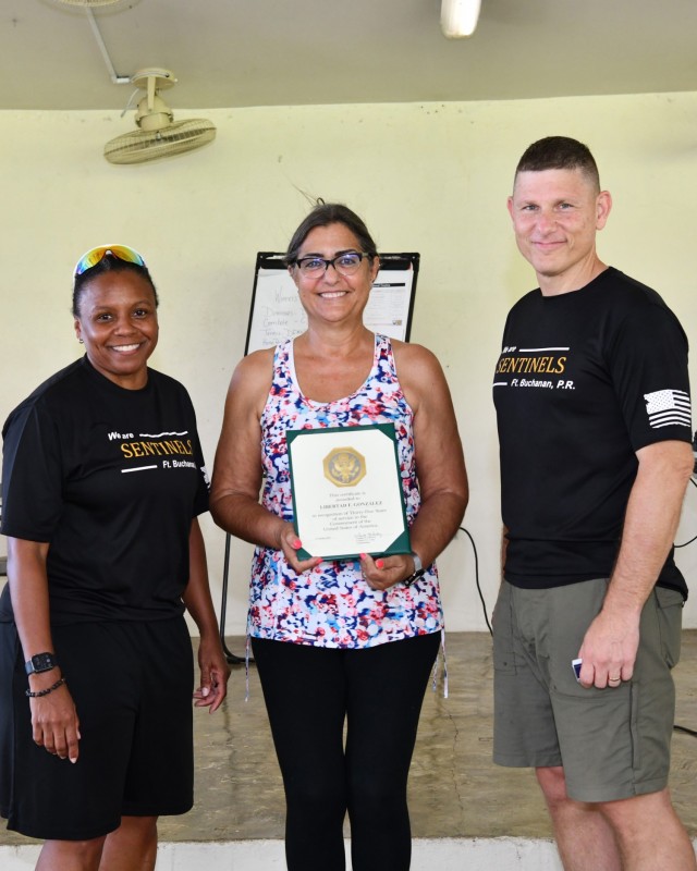 Directorate of Emergency Services Administrative Support Assistant, Libertad F. González received Thirty-Five years of Service to the Nation certificate and pin during the Town Hall.