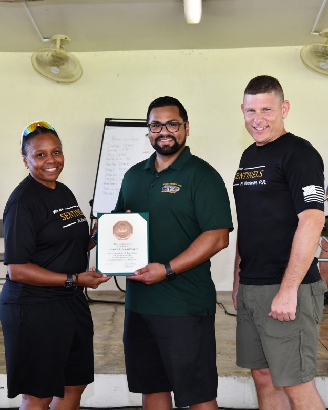 Resource Management Office, Budget Analyst Yaviel Luna-Pomales received the Ten Years of Service to the Nation certificate and pin during the Town Hall.