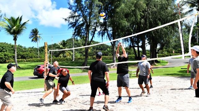 Everyone joined in the action during the Volleyball tournament, garrison staff (black shirts) vs. the Logistics Readiness Center Staff (grey shirts).