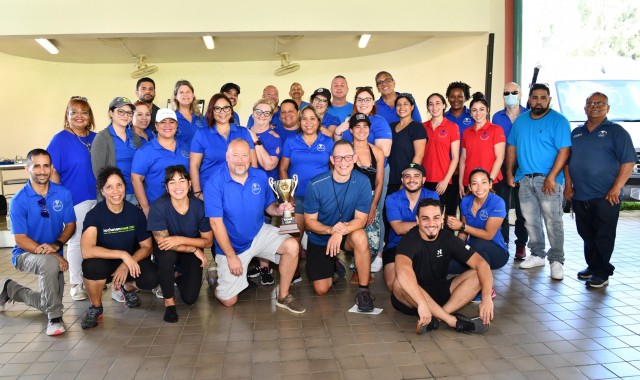 The Directorate of Family and, Morale, Welfare and Recreation staff were the winners of the coveted golden Garrison Cup having earned the highest points pose for a photograph with the winners’ cup.