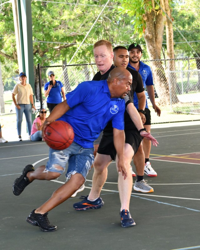 Garrison Command Group vs FMWR in a heated game of basketball.