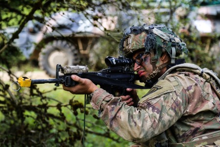 A Soldier scans sectors of fire during Exercise Saber Junction 22 at Joint Multinational Readiness Center in Hohenfels, Germany, Sept. 13, 2022. The exercise assesses soldier readiness in the execution of operations in a joint environment and promotes interoperability with allied and partner nations.