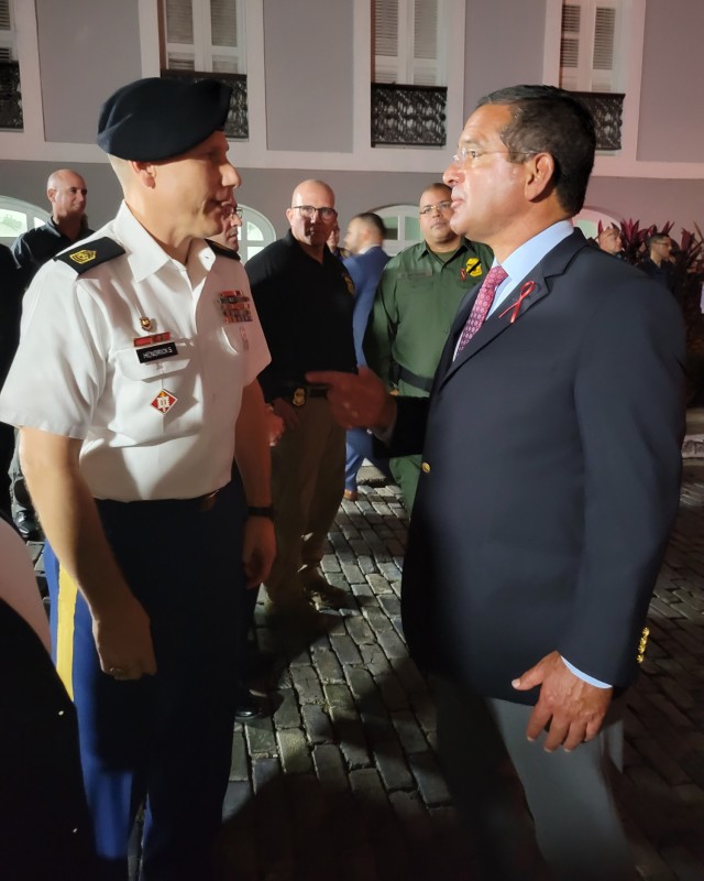 Fort Buchanan Garrison Command Sergeant Major Roderick W. Hendricks speaks with the Puerto Rico Governor Pedro R. Pierluisi about initiatives of mutual collaboration to enhance the support and resiliency of Fort Buchanan’s community.