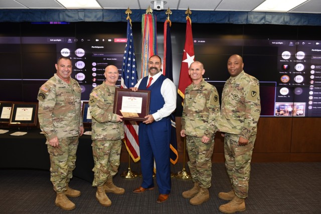 Shane Denning, center, an airfield manager in the Joint Readiness Training Center in the Directorate of Plans, Training, Mobilization and Security at Fort Polk, Louisiana, for the past two years, was IMCOM&#39;s representative to win the Army Materiel Command’s 2021 Louis Dellamonica Award for Outstanding Personnel of the Year. AMC Commander Gen. Ed Daly, second from left, presented the award. With Gen. Daly are Command Sgt. Major Albert Delgado, IMCOM Commanding General Lt. Gen. Omar Jones, second from right, and IMCOM Command Sgt. Major CSM Jason Copeland.