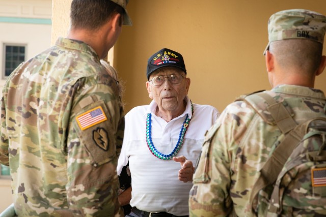 Private 2nd Class (ret.) Warren H. Schuster speaks with Soldiers from 2nd Battalion, 35th Infantry Regiment, 3rd Infantry Brigade Combat Team, 25th Infantry Division, during his visit to Schofield Barracks, Hawaii, Oct. 21, 2022. Accompanied by his three daughters, 91-year-old Schuster visited the 25th Inf. Div. and his prior unit more than seven decades after fighting and subsequently  being injured in the Korean War. (U.S. Army photo by Sgt. Rachel Christensen/28th Public Affairs Detachment)
