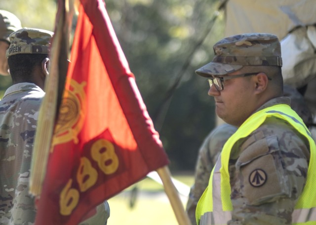 
2nd Lt. Austin Barnes, a transportation officer assigned to the 688th Rapid Port Opening Element, holds the guidon for his unit during a field training exercise at Fort Eustis, Va. Oct.6.
