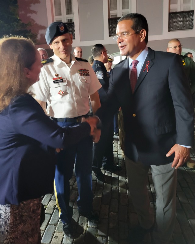 Puerto Rico Governor Pedro R. Pierluisi met Fort Buchanan Deputy to the Garrison Commander Yvette L. Castro and Garrison Command Sergeant Major Roderick W. Hendricks, who attended the event in representation of the Garrison Commander Col. Tomika M. Seaberry.