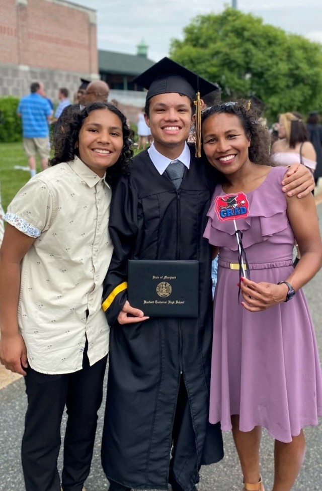 Sanders with her daughter and son at her son&#39;s high school graduation.
