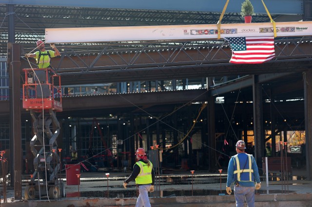 Contractor bolts last steel beam to new Van Voorhis Elementary School