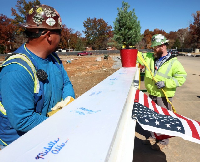 Contractor bolts last steel beam to new Van Voorhis Elementary School