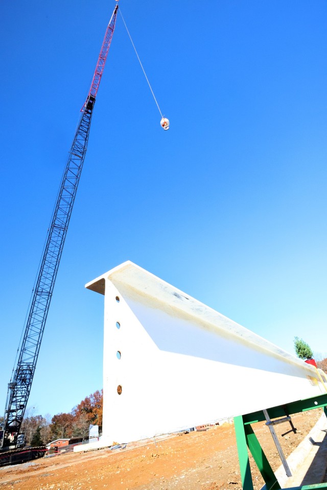 Contractor bolts last steel beam to new Van Voorhis Elementary School