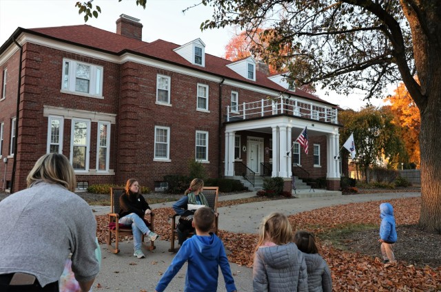 Volunteers share a spooky story about alleged ghostly happenings within Quarters 1 with attendees of the Haunted Knox Walk Oct. 27, 2022.