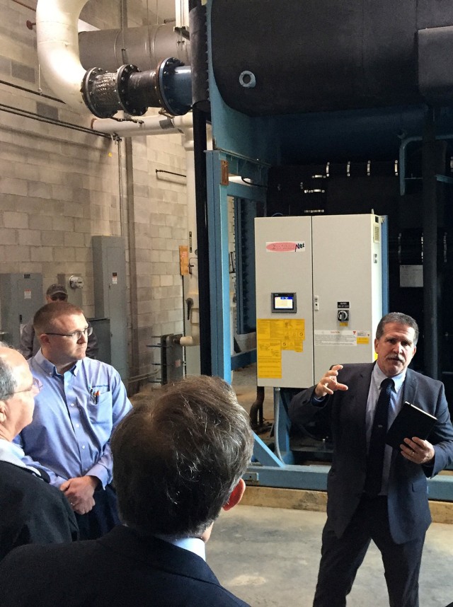 R.J. Dyrdek, energy manager for Fort Knox's Directorate of Public Works, explains to officials how one of the power generation stations around post operates, including its capability of saving the government countless millions of dollars each year through energy recycling.