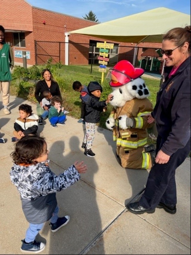 The Fort Detrick/Forest Glen Fire and Emergency Services Division and Sparky visit the Fort Detrick Child Development Center Oct. 12, 2022, during Fire Prevention Week. (U.S. Army photo)