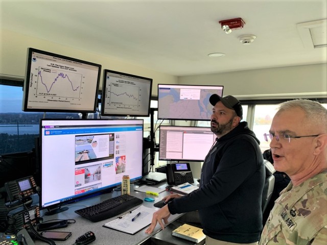 Mark Aldrich, a lockmaster with the U.S. Army Corps of Engineers, Detroit District, monitors lock traffic from a control tower at the historic Soo Locks facility in Sault Ste. Marie, Mich., Oct. 25 as Col. Steven Carozza, U.S. Army Tank-automotive...