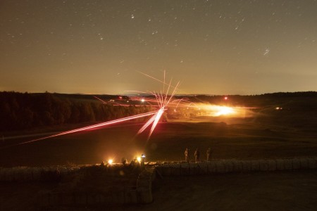 U.S. Army Paratroopers assigned to the 173rd Airborne Brigade breach a wired obstacle, an objective during a combined arms live fire exercise on a maneuver range at the Grafenwoehr Training Area, Germany, Sept. 22, 2022. 