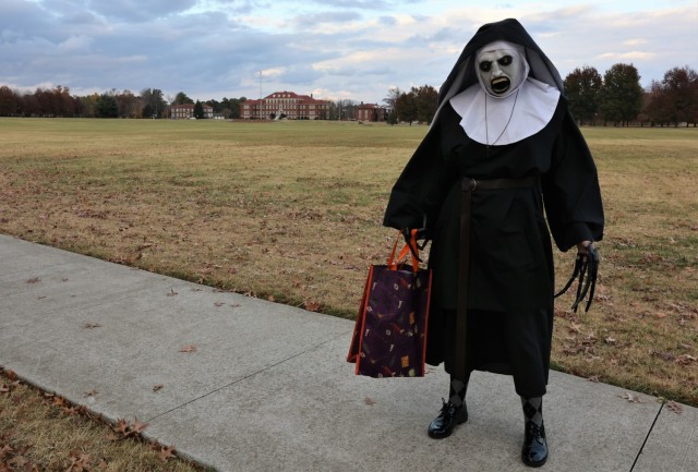 A trick-or-treater prepares to head into Fort Knox neighborhoods and collect candy Oct. 31, 2022.