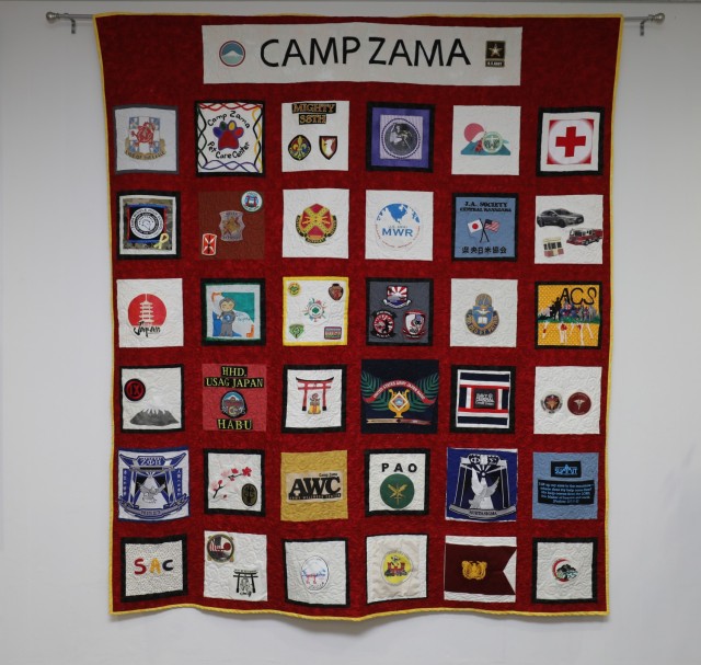 A community quilt was unveiled during a ceremony at the U.S. Army Garrison Japan headquarters at Camp Zama, Japan, Nov. 1, 2022. The first-ever community quilt was designed by more than 35 units and private organizations.