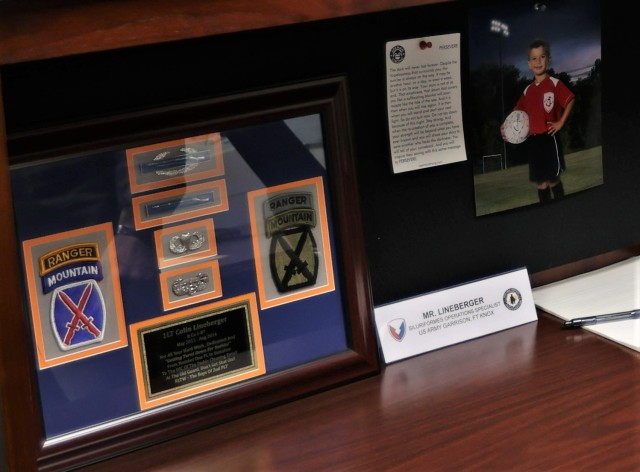 Fort Knox Installation Protection Branch chief Colin Lineberger keeps memories of his time in service on his office desk alongside his son’s photo and a message reminding him to always persevere.