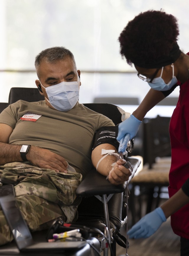 Garrison Command Sgt. Maj. Cesar Duran donates blood during a Community Blood Drive held Oct. 24 in the Moncrief Army Health Clinic multipurpose room. The drive, hosted by Fort Jackson and the American Red Cross, is held quarterly because of the blood shortage in the U.S.