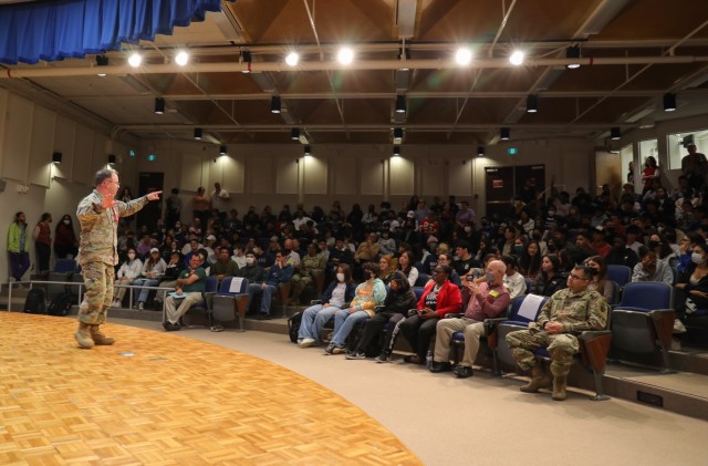 Col. Christopher L. Tomlinson, commander of the U.S. Army Garrison Japan, speaks to students during a Red Ribbon Week assembly inside the Zama Intermediate High School auditorium on Camp Zama, Japan, on November 3, 2022. Held each year, Red Ribbon Week is the nation's largest and longest-running drug prevention campaign that has reached millions of people around the world, according to the National Family Partnership . 