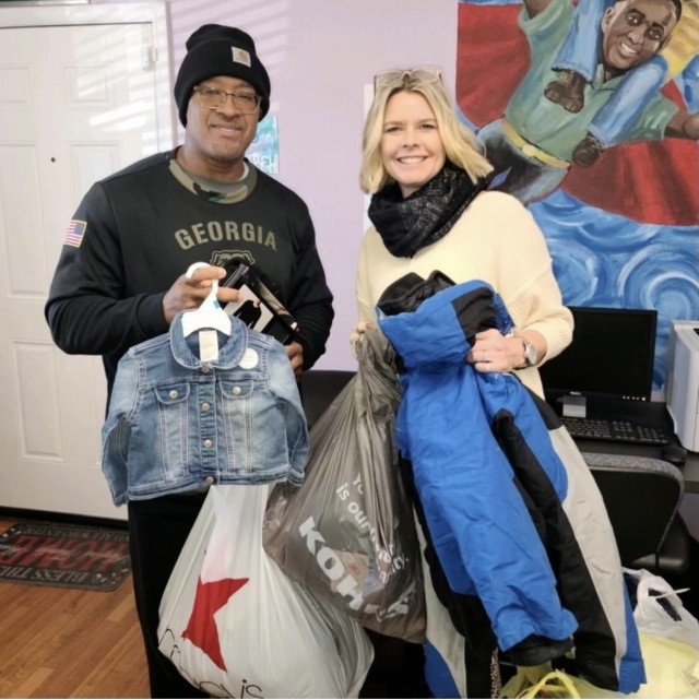 Michael Bennett and Heather Volk collect clothing for the Harford Family House, which is located in Aberdeen, Maryland. Bennett volunteers at the Harford Family House, and Volk is the HFH resource development manager.