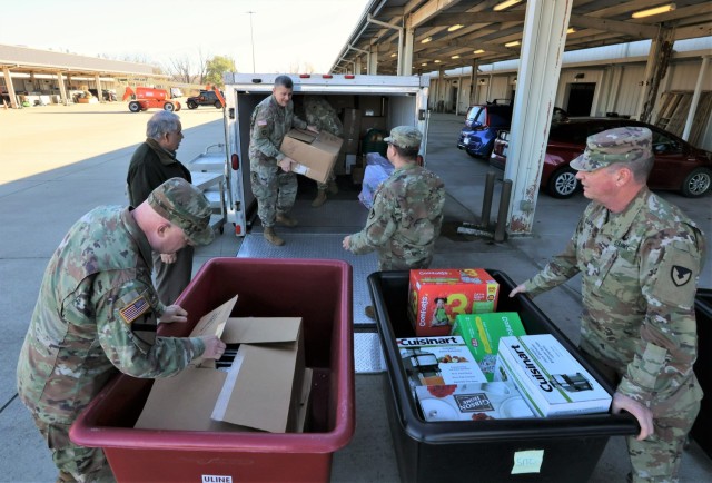 Chaplains and members of the Fort Knox Religious Support Office bring a trailer loaded with donated toys, clothes and other household items to the Warrior Warehouse Nov. 3, 2022 to help Families in need.