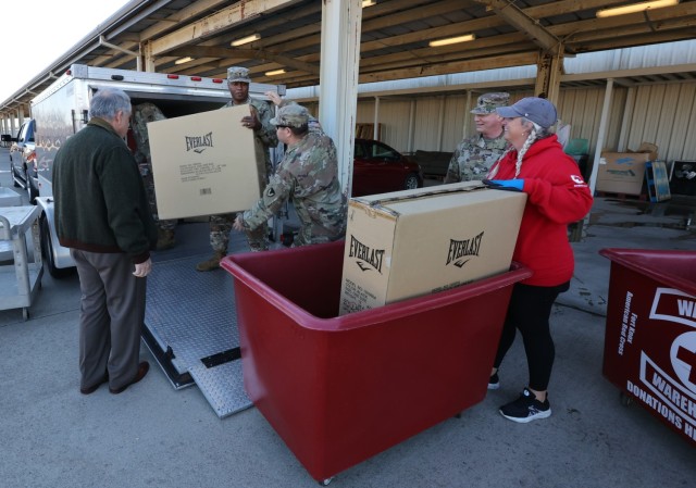 Chaplains and members of the Fort Knox Religious Support Office bring a trailer loaded with donated toys, clothes and other household items to the Warrior Warehouse Nov. 3, 2022 to help Families in need.
