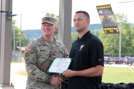 Maj. Gen. Darren Werner, Army Materiel Command acting deputy commanding general, awards an Army Commendation Medal to Sgt. Deven Guelde. He will serve as an alternate for the Best Squad Competition during an August 18 luncheon at Redstone Arsenal, Ala. Guelde is currently stationed at U.S. Army Garrison-Benelux Directorate of Emergency Services as an operations sergeant.