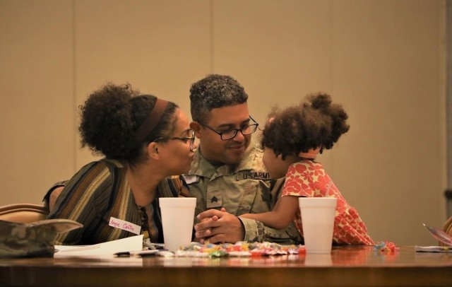 Sgt. Emmanuel Diaz, A Soldier assigned to 3rd Division Sustainment Brigade, attends a Strong Bonds event with his spouse, Angie Castro, and daughter, Oct. 27 on Fort Stewart, Georgia. Strong Bonds events provide Soldiers and their loved ones with relationship education and skills training in a setting that inspires hope and fosters fellowship. (U.S. Army photo by Spc. Elsi Delgado, 3rd Division Sustainment Brigade Public Affairs)