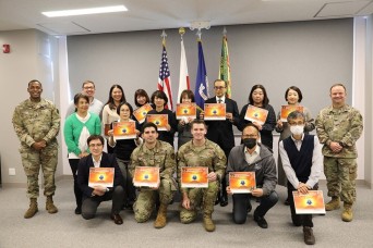 YOKOTA AIR BASE, Japan – U.S. Army Garrison Japan leadership presented awards to personnel in the Air Force’s 374th Contracting Squadron Wednesday for h...