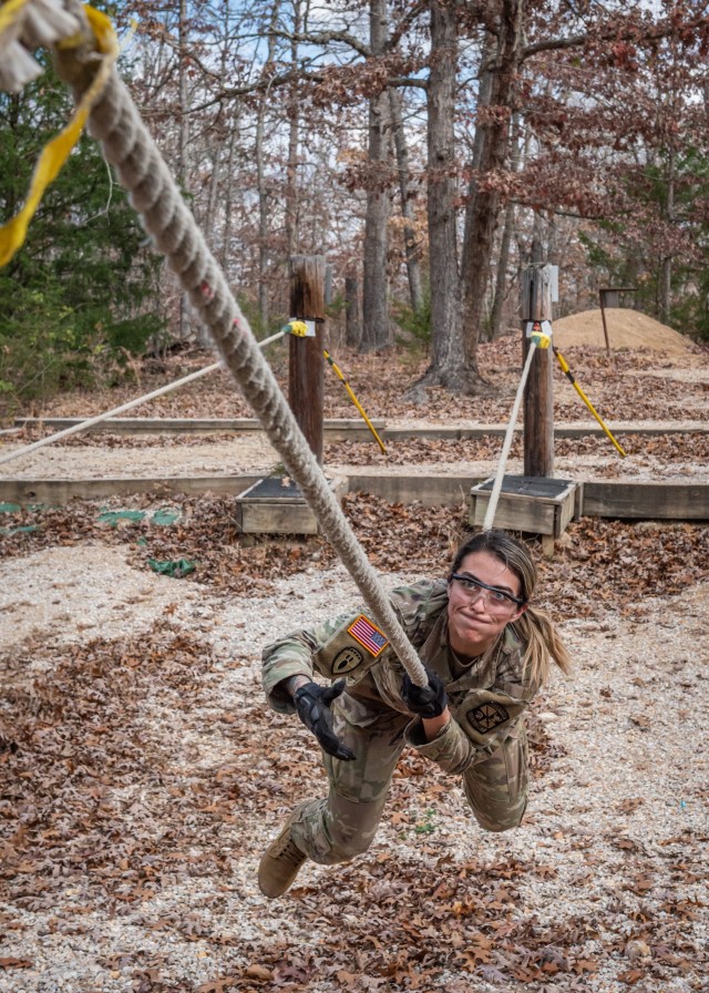 Cadet Michelle Justiniano, from the University of Illinois-Chicago five-person team, attempts to cross the one-rope bridge portion of Fort Leonard Wood’s Physical Endurance Course Friday during the 3rd Brigade ROTC Ranger Challenge, which took...