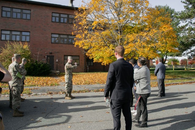 LTC Trent Colestock briefs the Staff Delegates about the building they are about to tour.