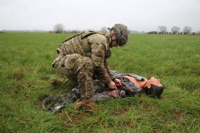 Spc. Patrick Z. Chayeb, performs lifesaving action on a dummy during the medical lane portion of the Benelux Best Warrior Competition on Chièvres Air Base in Chièvres, Belgium on Feb. 8, 2022. (U.S. Army photo by Libby Weiler, USAG Benelux Public Affairs)