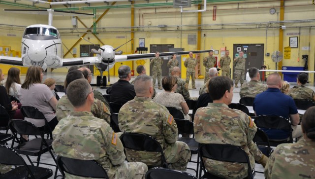 Audience members listen during a deployment ceremony for six New York Army National Guard Soldiers assigned to Detachment 5 of Company C, 2nd Battalion, 245th Aviation Regiment held at Army Aviation Support Facility # 3 in Latham, New York on November 6, 2022. The Soldiers, who fly the C-12 Huron transport aircraft, will deploy to Djibouti in East Africa to support United States military forces in the region.