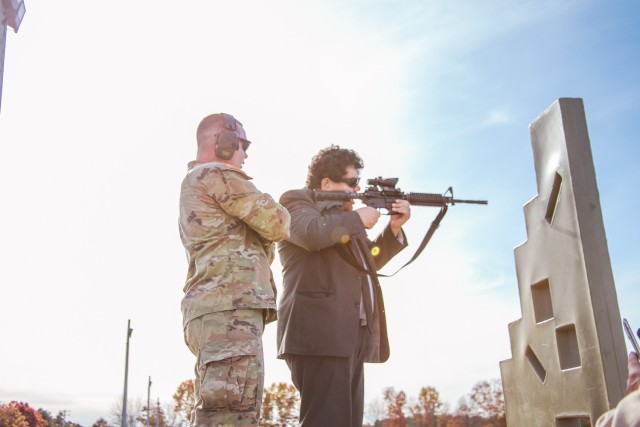 SGT Fletcher monitors as one of the Staff Delegates fires an M4 for for the first time. 