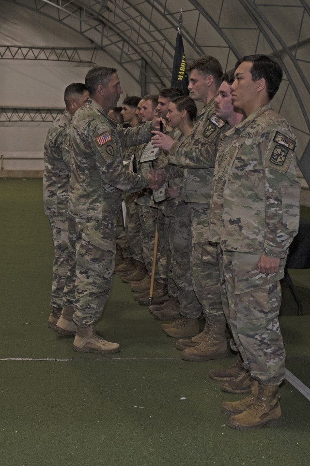 Col. Adam Lewis, 3rd Brigade Army ROTC commander (second from left), and brigade Command Sgt. Maj. Frank Guerrero (behind Lewis) present certificates to the nine-person team winners of the brigade’s Ranger Challenge competition Saturday on Fort Leonard Wood. After two full days and 14 military skills competition events – including tasks such as completing an obstacle course, rendering first aid and a weapons skills assessment – cadets from Marquette University, in Milwaukee, Wisconsin, were the winners of both the five- and nine-person team divisions. 