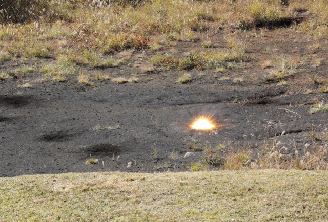 A hand grenade explodes on a small range at Combined Arms Training Center Camp Fuji, Japan, Nov. 2, 2022. About 30 Soldiers from the 35th Combat Sustainment Support Battalion threw grenades during a week of live-fire training that also included small arms and crew-served weapons to better prepare the unit for possible base defense missions. 