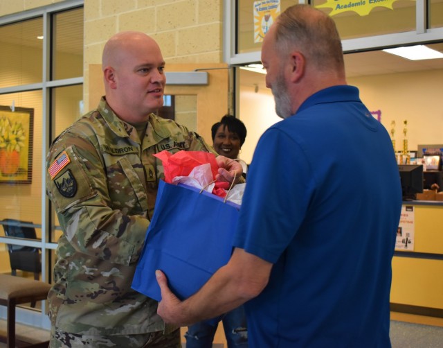 Signal Soldiers from Fort Gordon&#39;s Training and Education Development Division, U.S. Army Signal School, presented tokens of appreciation for veterans who are now elementary educators at A. Dorothy Hains Elementary School in Augusta.
