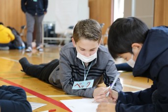 KURIHARA ELEMENTARY SCHOOL, Japan – Approximately 60 fifth graders from Arnn Elementary School visited Kurihara Elementary School, located near Camp Zam...