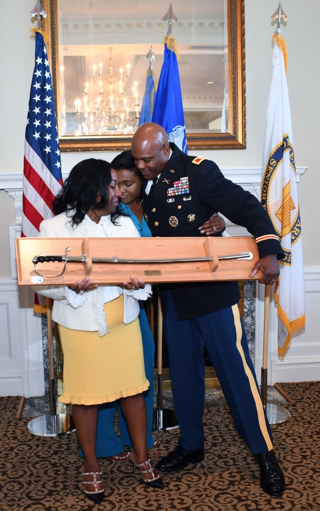 COL. Smith and the presentation of gifts from his wife and daughter. 