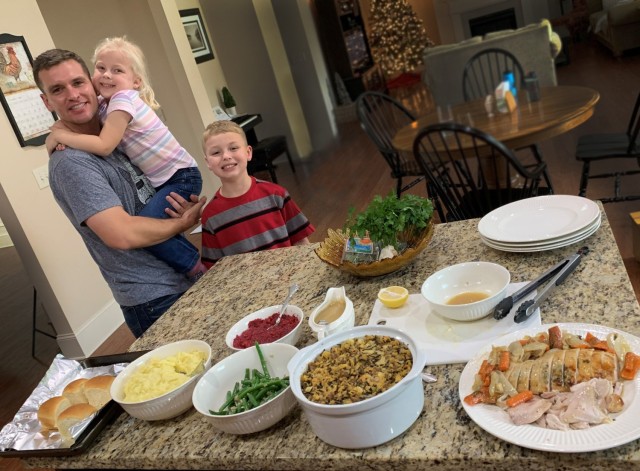 Chief Warrant Officer 4 Bill DeHaan with his children, Ella (5) and Jackson (8), on Thanksgiving in 2018 while stationed at Fort Benning, Georgia. Over his 20 years of active-duty service and numerous different duty stations, making Thanksgiving...