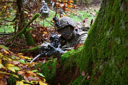 Army Pfc. Oswald Johnson provides simulated security during a training exercise at the Grafenwoehr Training Area in Germany, Oct. 18, 2022.